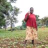 High-iron bean farmer Sarah Ikarot stands in a field where tobacco once grew.