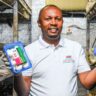 Garden mushrooms director Dennis Macharia poses with packaged button mushrooms at his farm in Matuguta Githunguri, Kiambu County on October 28, 2024.